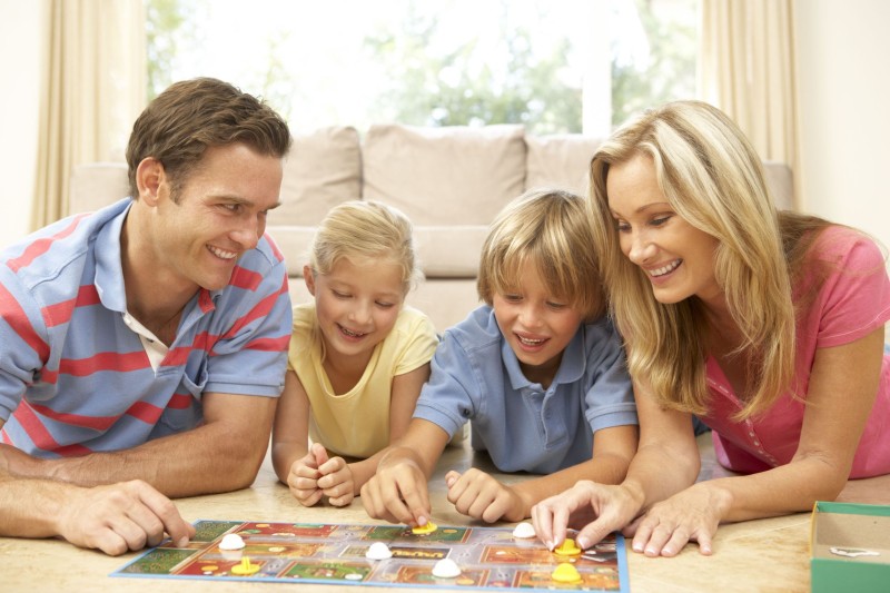 Family playing game with toddlers